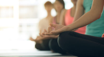 Young women yoga indoors keep calm and meditates while practicin Young women yoga indoors keep calm and meditates while practicing yoga to explore the Inner Peace. Yoga and meditation have good benefits for health. Photo concept for Yoga Sport and Healthy lifestyle